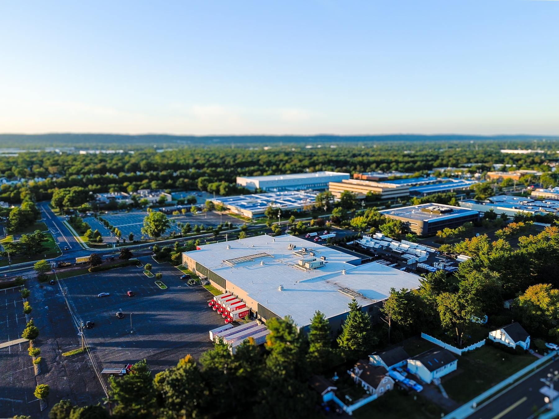 Aerial of the building’s front corner and landscaped frontage on Centennial Avenue